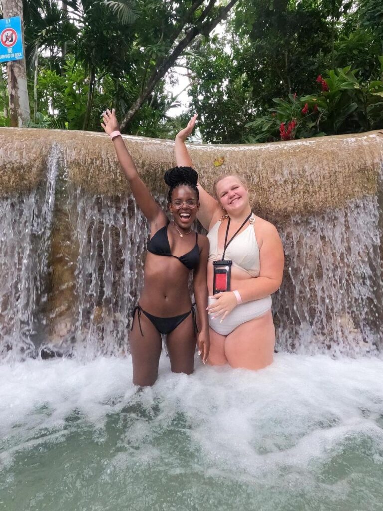 Visitors climbing Dunn's River Falls waterfall in Ocho Rios Jamaica