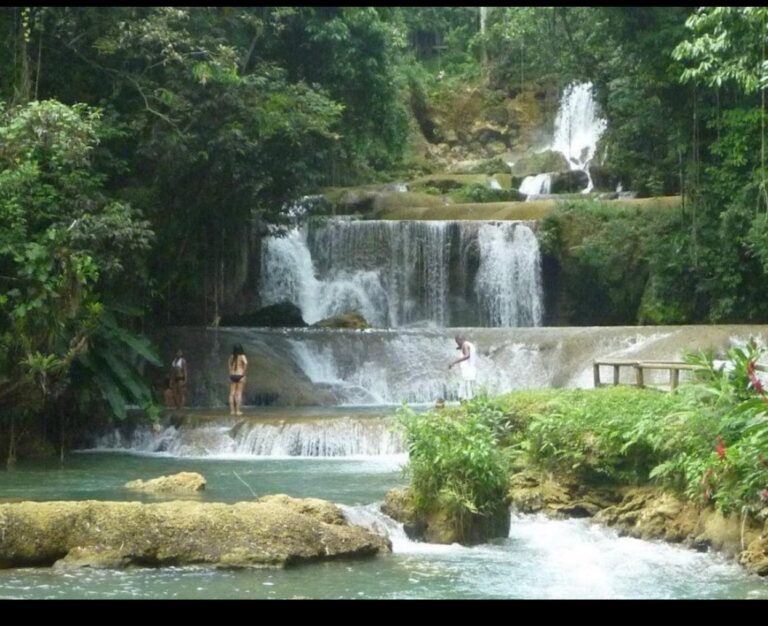 Visitors enjoying the waterfalls and pools at YS Falls Jamaica